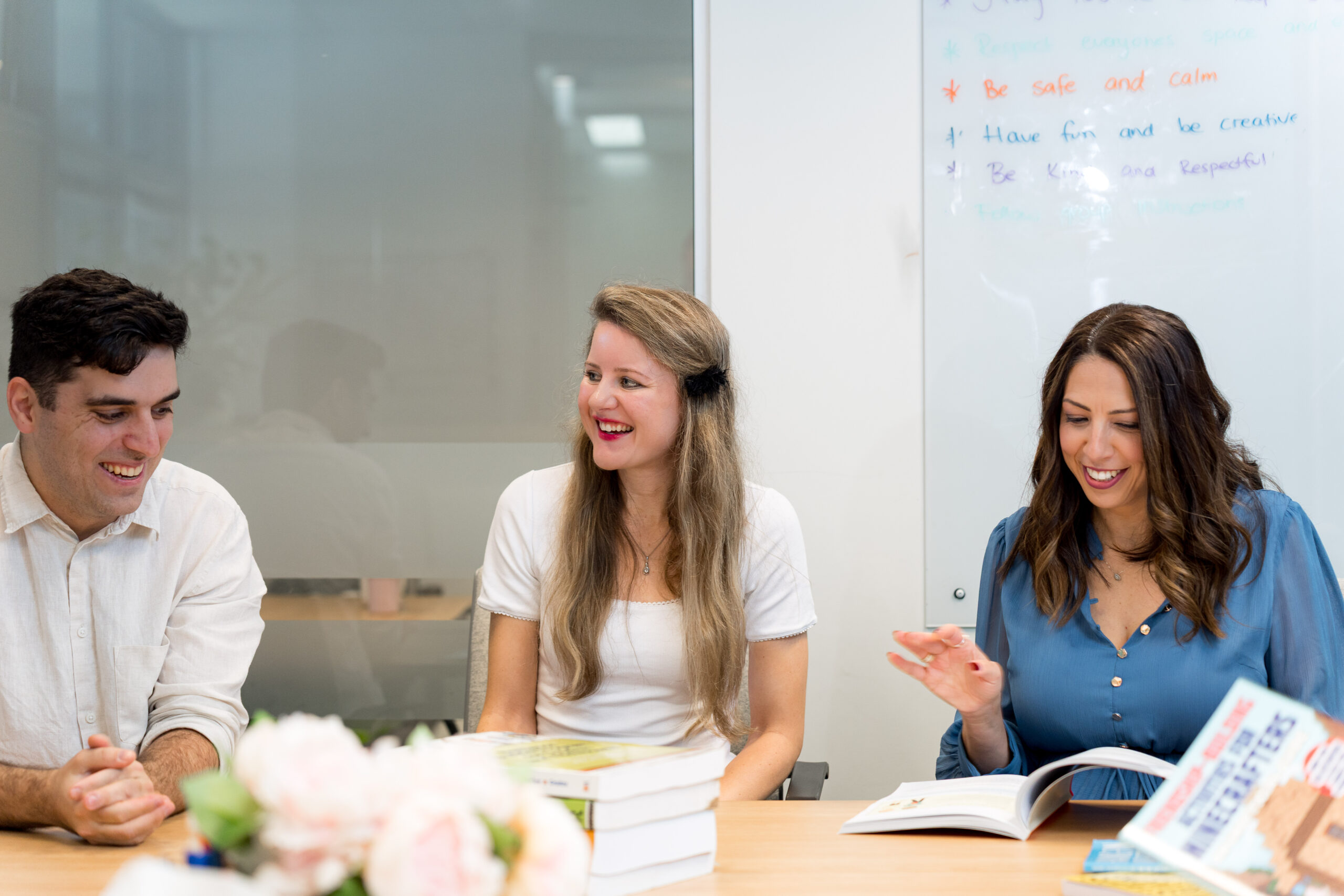 The Social Space team talking together around a table